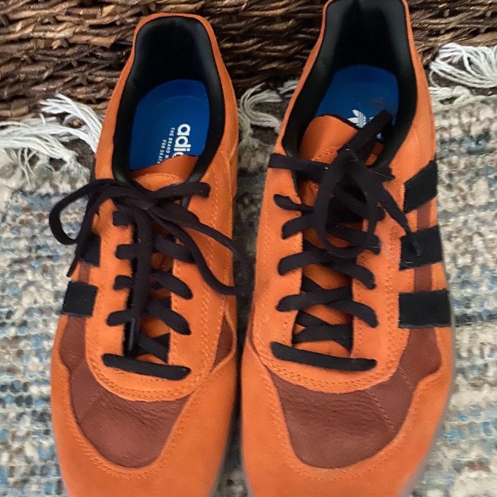 Adidas Orange and Black Sneakers with Signature Stripes